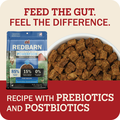 Red Barn Powerfood Digestive Health recipe with prebiotics and postbiotics dog food pouch shown next to a bowl of brown kibble cubes, with promotional text on a beige and red background.