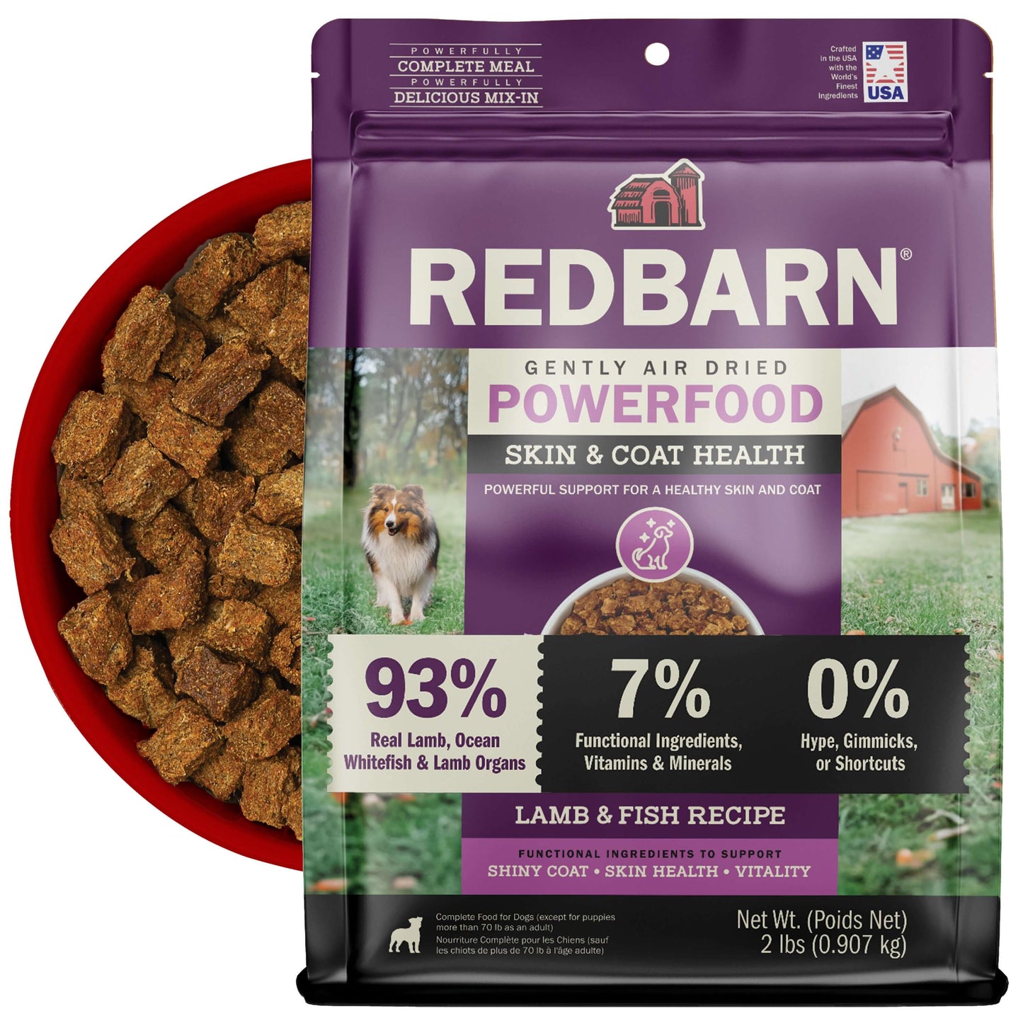Redbarn Gently Air Dried Powerfood Skin & Coat Health Lamb & Fish Recipe with a bowl of the Air Dried Food in the back on a white background