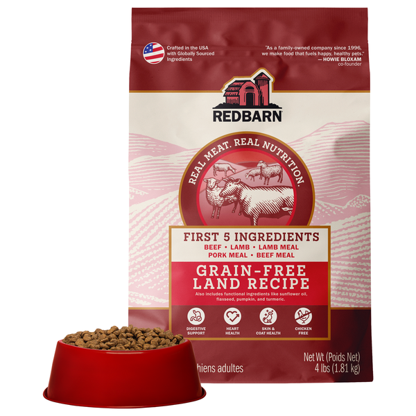 Best Grain Free Dog Kibble. Redbarn grain-free land recipe dog food package with a bowl of dog food on a white background