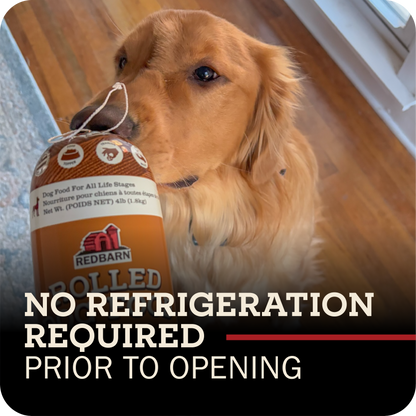 Dog playing with a Redbarn rolled dog food 