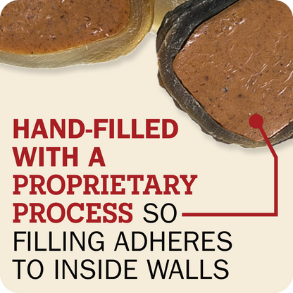 Close-up of two Redbarn Peanut Butter Filled Cow Hoof with text reading 'HAND-FILLED WITH A PROPRIETARY PROCESS SO FILLING ADHERES TO INSIDE WALLS' on a cream background.