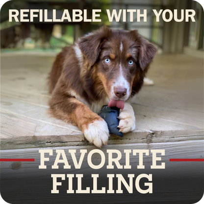 A brown and white dog lying on a wooden deck holding a Redbarn Peanut Butter Filled Cow Hoof, with large text reading 'REFILLABLE WITH YOUR FAVORITE FILLING' over the photo.