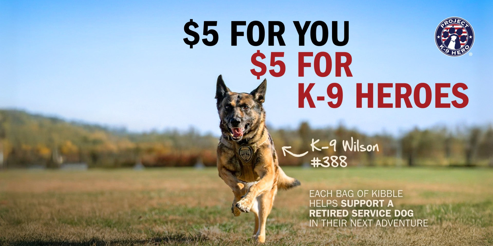 A German Shepherd dog runs across an open grassy field under a blue sky, with promotional text reading '$5 FOR YOU $5 FOR K-9 HEROES' and a circular logo in the top right.